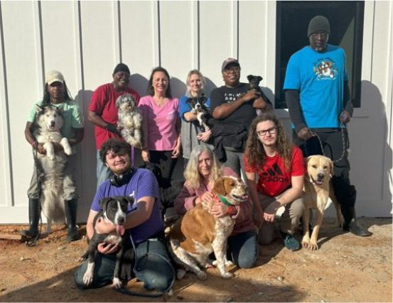 OCHS Staff with adoptable dogs